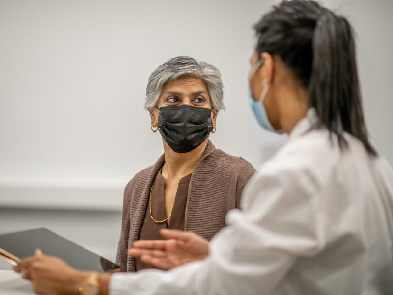 a patient and provider conversing