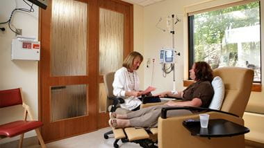 lipson cancer institute, doctor providing infusion to a patient
