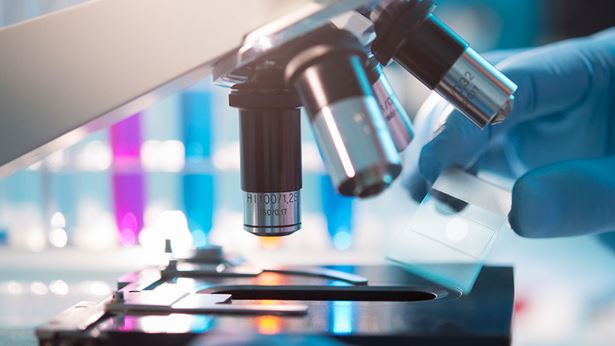 A microscope examining pathology slides.