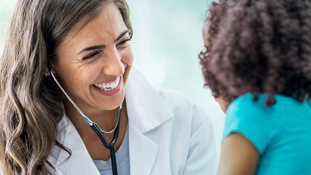 image of a pediatrician and a female child