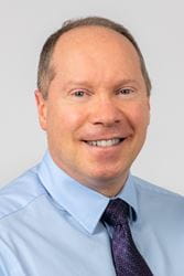 Headshot of Reverend E. Scott Bassett