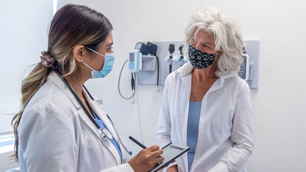 Senior with doctor