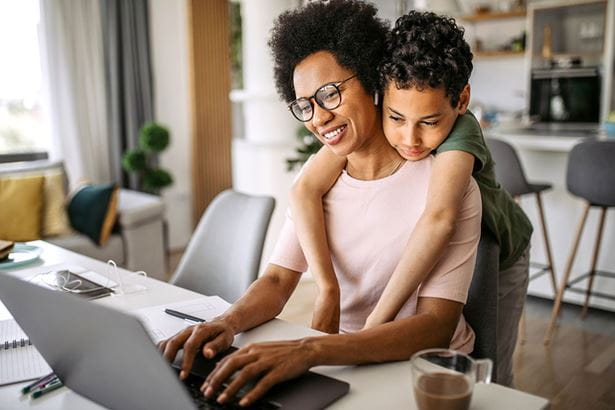 Women and her son scheduling an appointment online