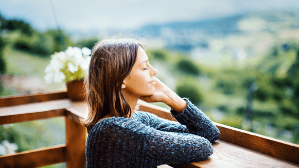 Young woman looking out with a view